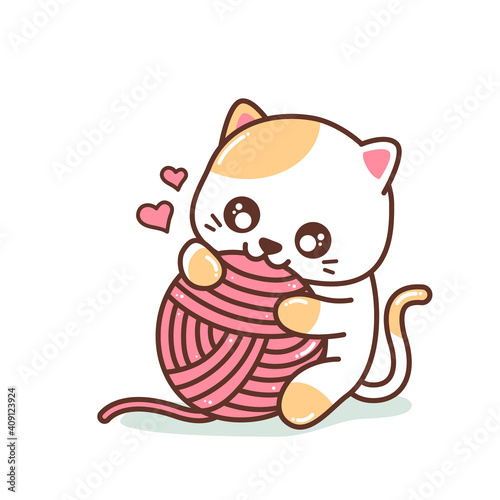 cute little kitten playing with yarn ball