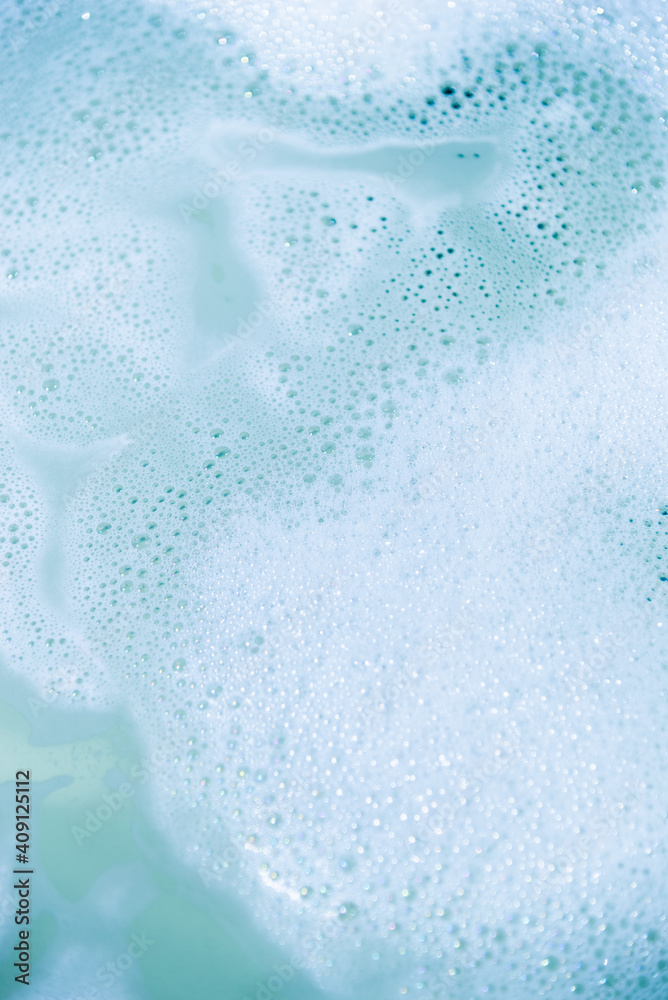 water foam and bubbles of blue color as background. cosmetology concept water foam and bubbles of blue color as background. cosmetology concept