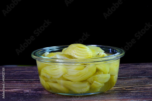 pickled mangoes in glass bowl photo