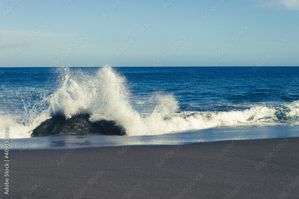 Fototapeta premium Atlantic ocean, strong waves, splashing, breaking on coast, rocks, volcanic island, Azores.