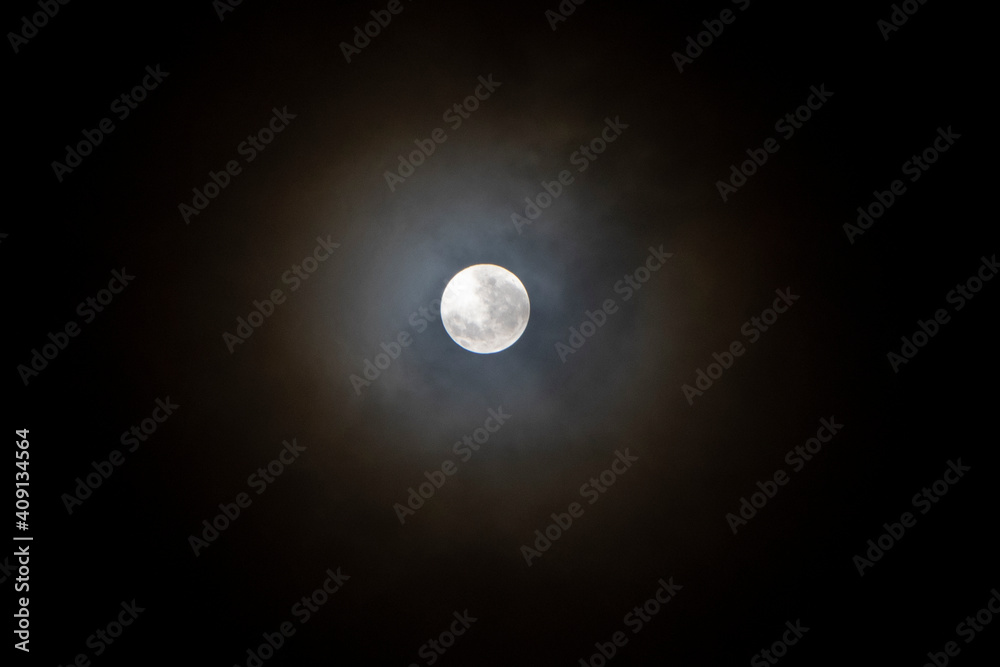 Recife / Pernambuco / Brazil. December, 20.2021. Month full moon seen between clouds. Recife / Pernambuco / Brazil. December, 20.2021. Month full moon seen between clouds.