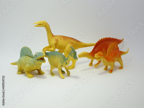 Fototapeta Naklejka Na Ścianę i Meble -  Group of toy dinosaurs. Plastic dinosaurs. Toys for young children. Jurassic time