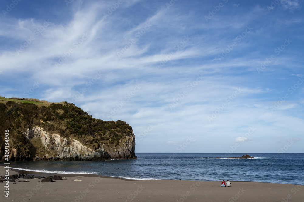 Two people sitting on beach, lovers enjoying, good weather, Azores, Sao Miguel.