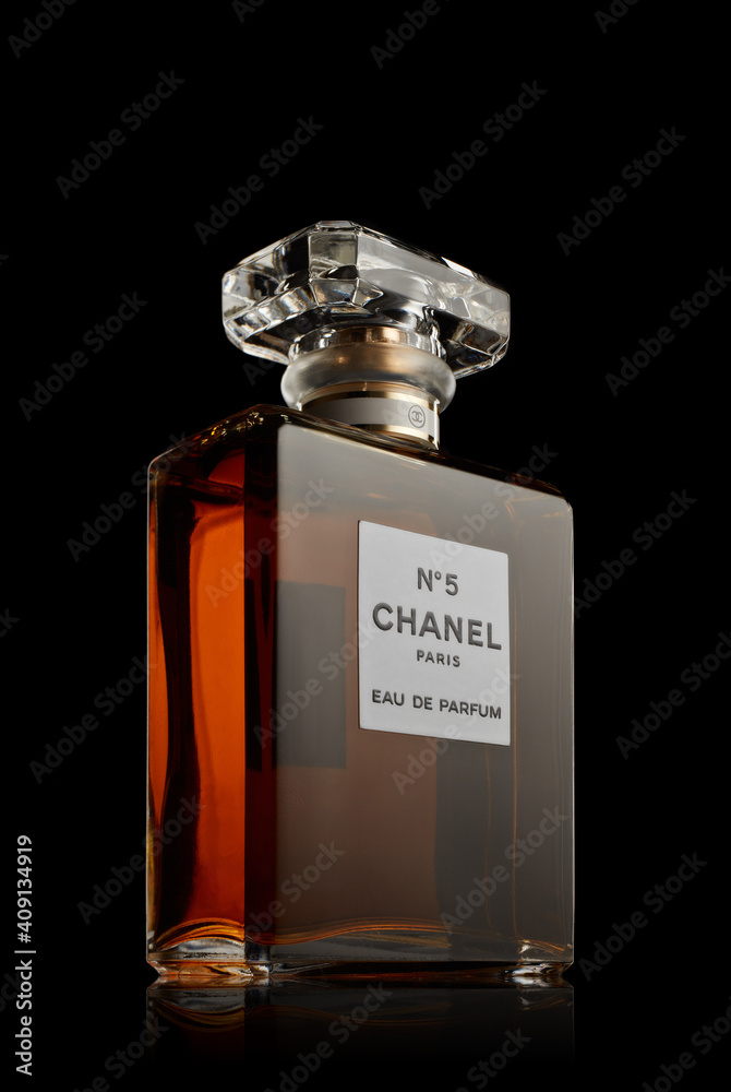 Bottle of perfume Chanel № 5. on black background. Coco Chanel Stock Photo