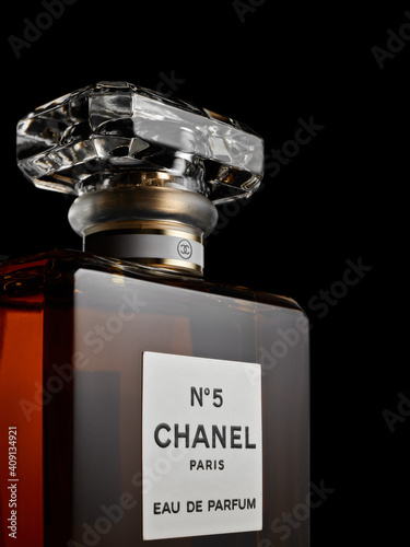 Bottle of perfume Chanel № 5. on black background. Coco Chanel Stock Photo