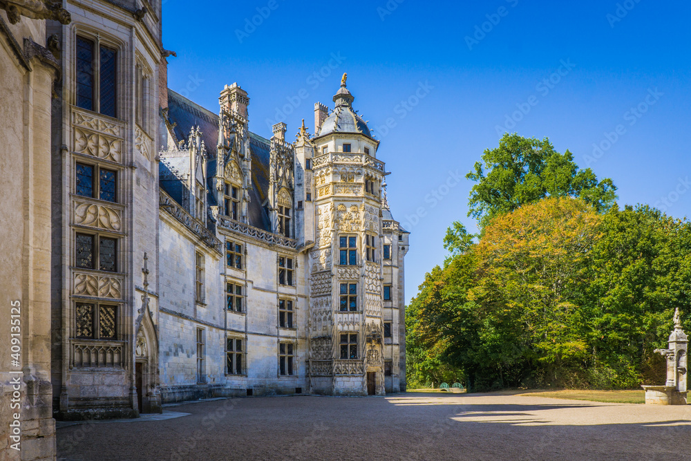 The finely carved gothic facade of the beautiful Meillant castle in the Berry region (France)