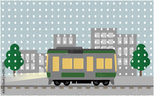 	雪の中、ライトを点けて都市を走る電車のベクターイラスト