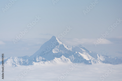 Deep Wintry Mountain Of Dachstein Mountain Above The Fog photo