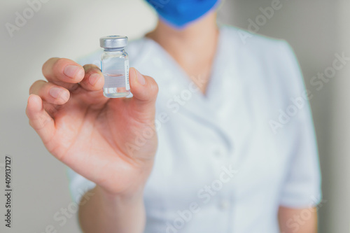 Nurse showing a medical sample container