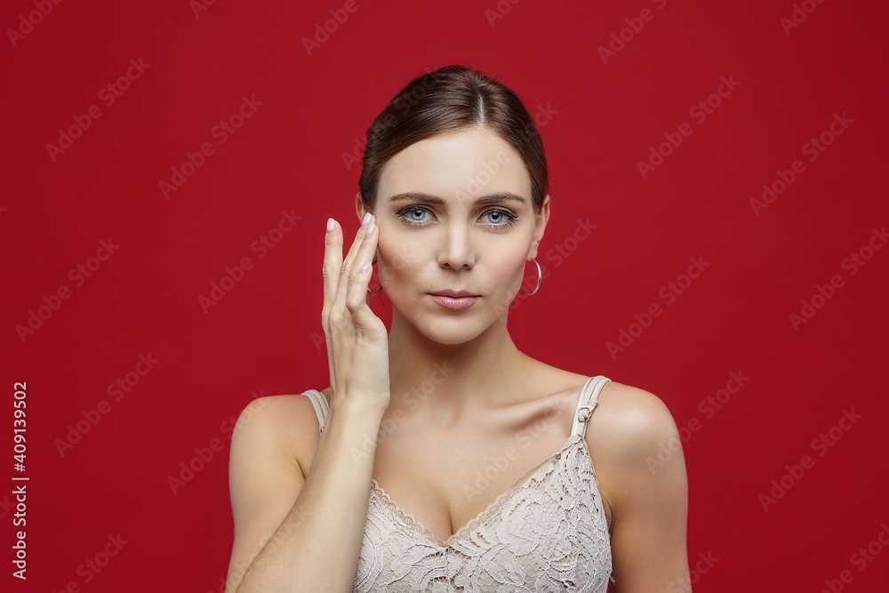 portrait of a beautiful female ballerina. in the studio on a red background portrait of a beautiful female ballerina. in the studio on a red background
