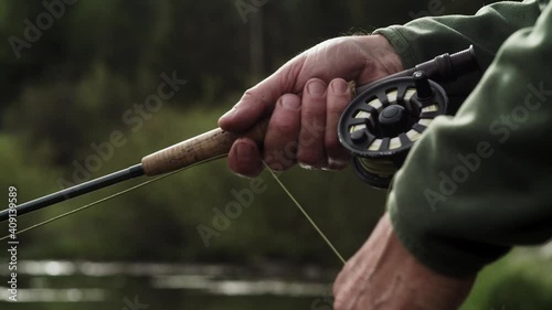 Fly Fisherman Hands Close Up Fishing on Mountain River in Colorado 
