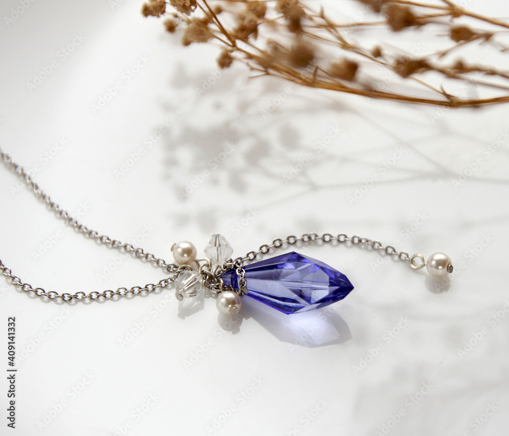 Beautiful blue crystal necklace with silver gold chain Beautiful blue crystal necklace with silver gold chain