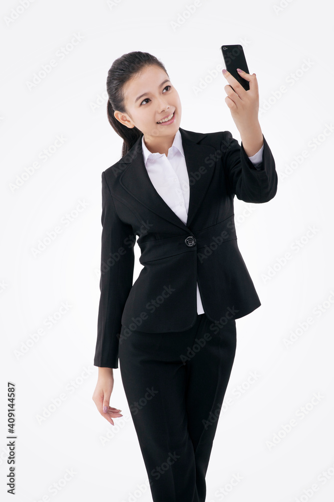 Oriental fashion business woman using mobile phone self-timer Oriental fashion business woman using mobile phone self-timer