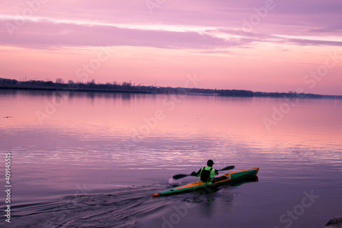 man kayaking in the river