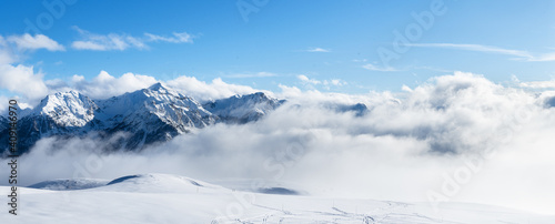 Ski resort landscape on clear sunny day. Panoramic view of mountains near Brianson, Serre Chevalier resort. Mountain ski resort. Snow slope. Snowy mountains. Winter vacation.