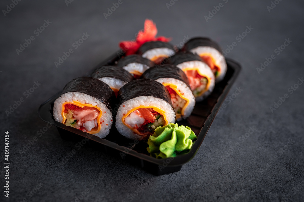 Traditional Japanese rolls with shrimp and cheese in box