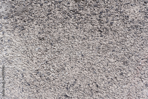 Flat texture of small grey and white pebbles background concrete asphalt road or building wall surface in Sofia  Bulgaria  Eastern Europe