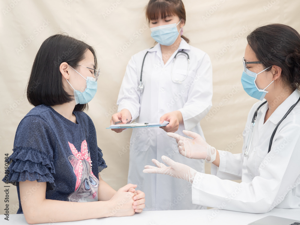 Fototapeta premium doctor and female patient in a inflatble hospital, examination a woman, medical checkup result and giving advice to find out way to solve illness. healthcare concept.