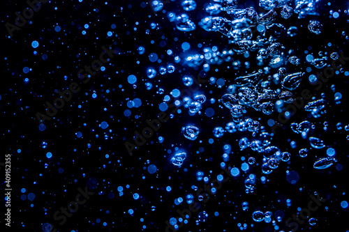 Blue glitter bokeh vintage lights with black background
