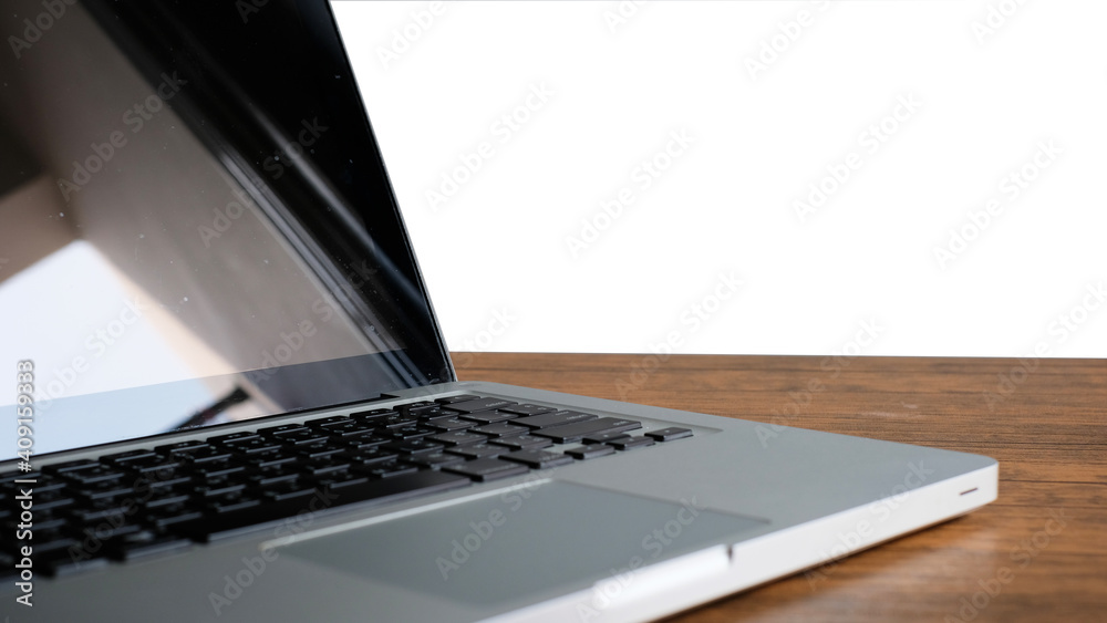 Laptop with blank screen on wood table. Laptop with blank screen on wood table.
