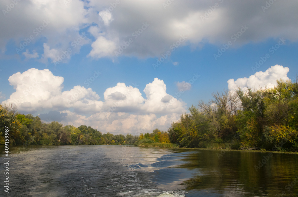 Autumn landscape on the river with trees on the bank Autumn landscape on the river with trees on the bank