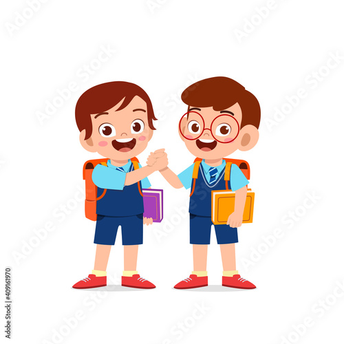 cute little kid boy holding hand with his friend