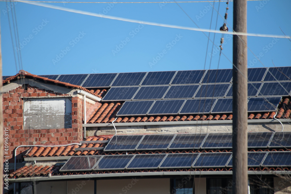 solar panels on the roof of a house alternative energy green fir tree