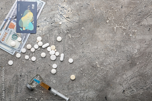 Syringe, drugs and money on...