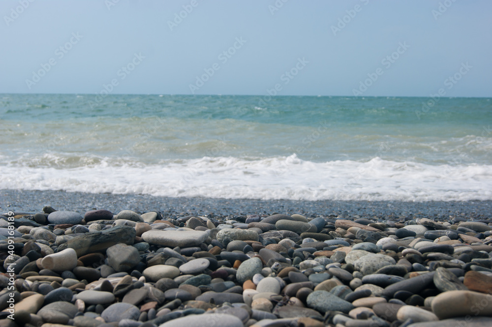 A small storm three or four points at sea, the wave hits the shore with a large pebble. A small storm three or four points at sea, the wave hits the shore with a large pebble.