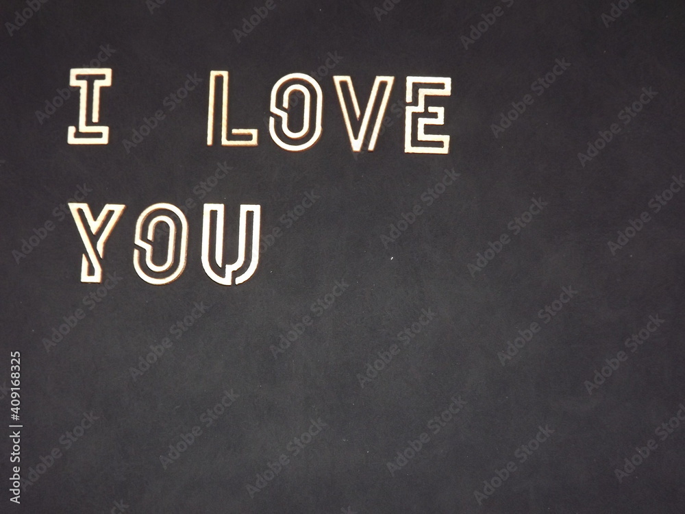 Obraz premium the words I love you and hearts made of wood on Valentine's day. High quality photo