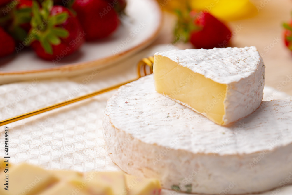Soft cheese, strawberry and white chocolate close up Soft cheese, strawberry and white chocolate close up