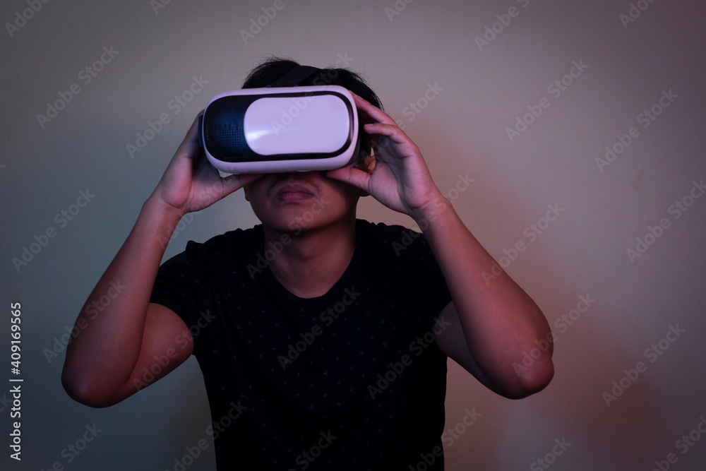 A man wearing virtual reality glasses touches video and new technology. A man wearing virtual reality glasses touches video and new technology.
