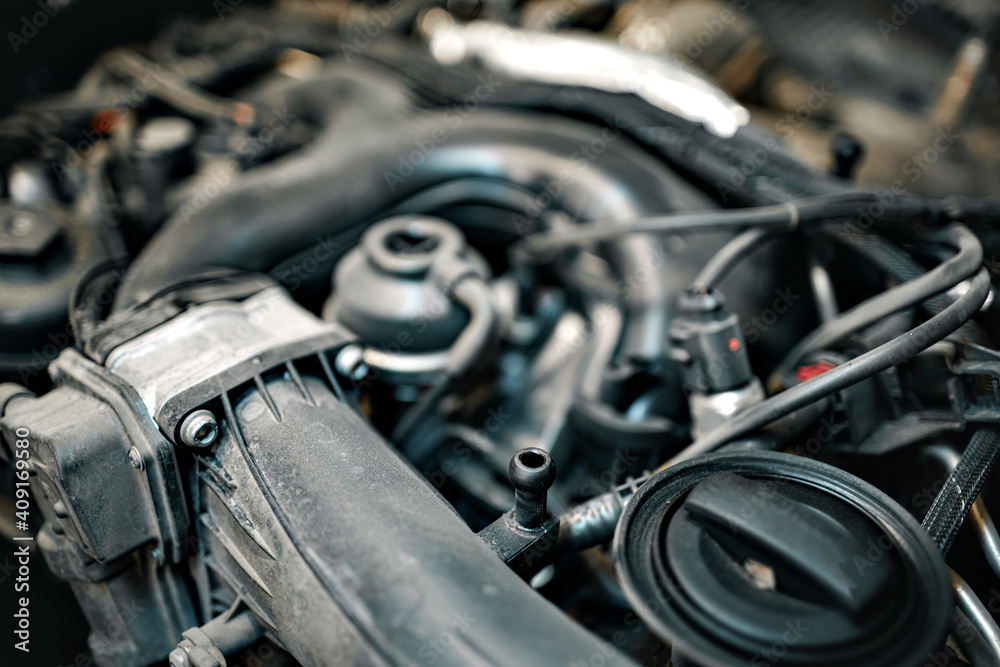 Dirty engine under the hood of a car Dirty engine under the hood of a car