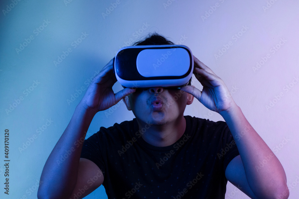 A man wearing virtual reality glasses touches video and new technology. A man wearing virtual reality glasses touches video and new technology.