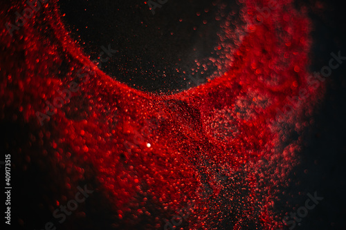 Wallpaper Mural Red sun made of sequins. Scattered sequins on a black background. Space texture. Torontodigital.ca