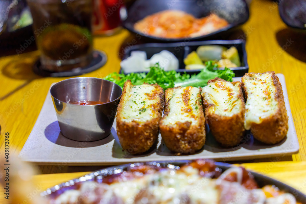 Baked mozzarella chicken rolls. Crispy crust, inside is rolled fresh tender chicken and mozzarella cheese. Serve with sweet and sour sauce