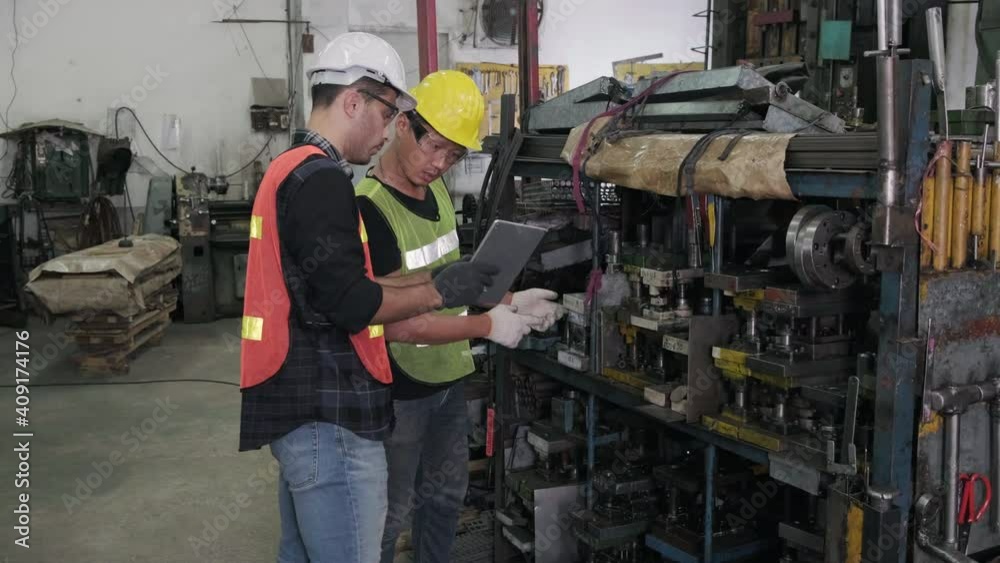 Engineers and technicians are checking the warehouse equipment in the factory. engineering and industrial concept. Engineers and technicians are checking the warehouse equipment in the factory. engineering and industrial concept.