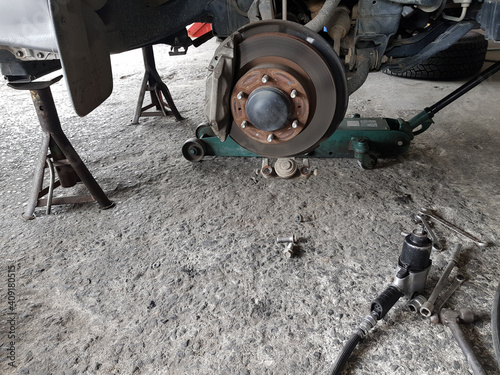 Fototapeta Naklejka Na Ścianę i Meble -  Close-up vehicle axle inspection, disc brake