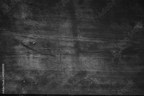 Old rustic wood background with knots and old aged grain patina ancient dark wood