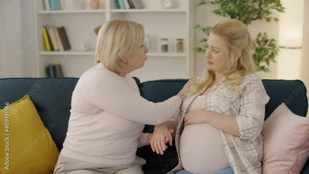 Caring female comforting expecting daughter, family support during pregnancy Caring female comforting expecting daughter, family support during pregnancy