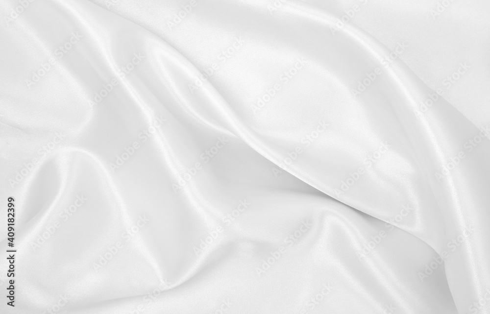 Smooth elegant white silk or satin luxury cloth texture as wedding background. Luxurious background design