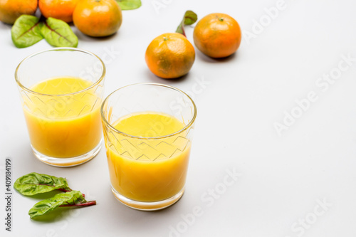 Citrus fruit juice in glasses.