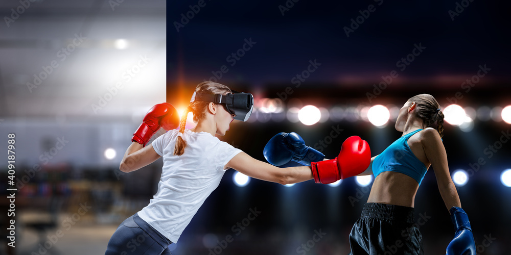 Young woman boxing in VR glasses