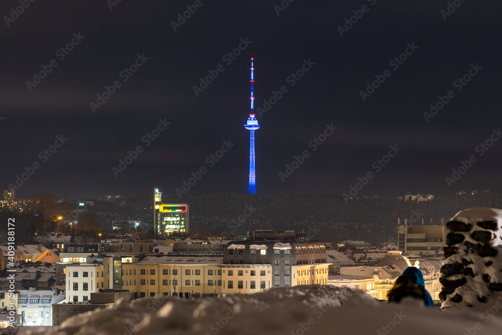 Vilnius city view with TV tower on background in winter with snow,