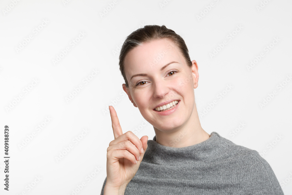 smiling woman rises her trigger finger smiling woman rises her trigger finger