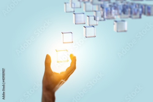 Hand holding glowing cubes. Innovation and creativity concept.