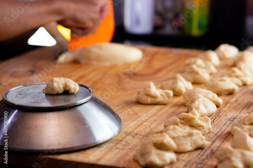 person preparing dough for baking