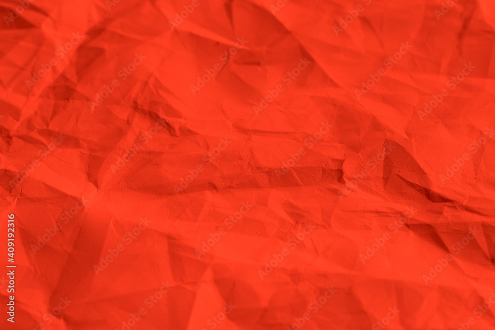 Texture of red crumpled paper.