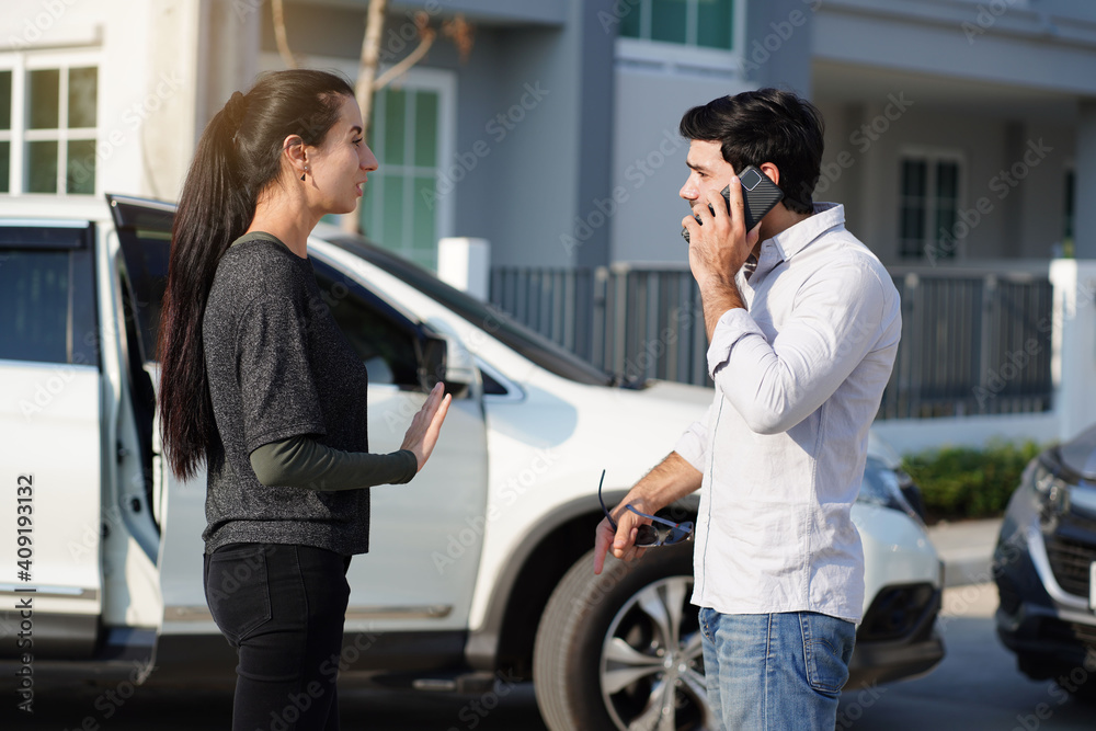 Handsome man quarreled with a beautiful woman in a car accident and used his smartphone to call for insurance and claim the damage. Handsome man quarreled with a beautiful woman in a car accident and used his smartphone to call for insurance and claim the damage.