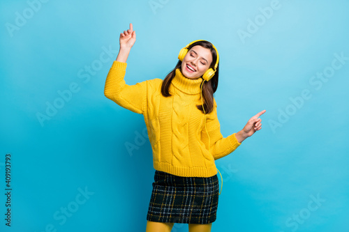 Canvas Print Portrait of pretty dreamy cheerful girl fan listening single hit dancing having